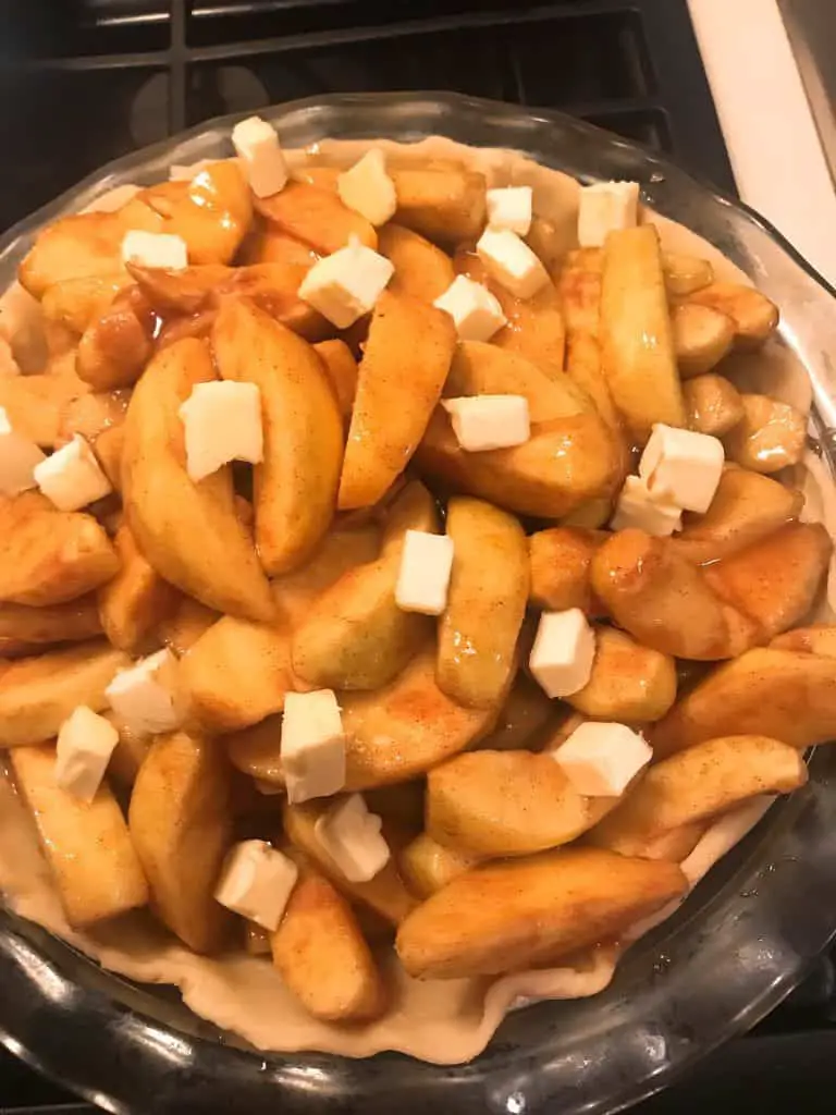 best apple pie recipe filling topped with butter