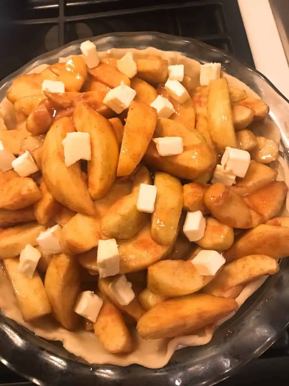 best apple pie recipe filling topped with butter