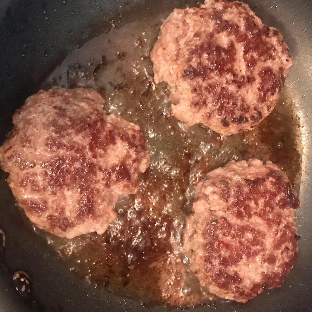 cooking burger with butter